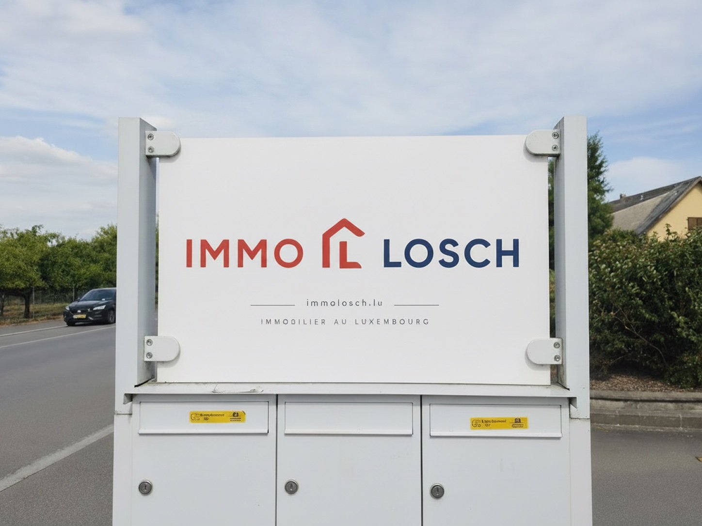 The ImmoLosch sign outside the office in Hellange